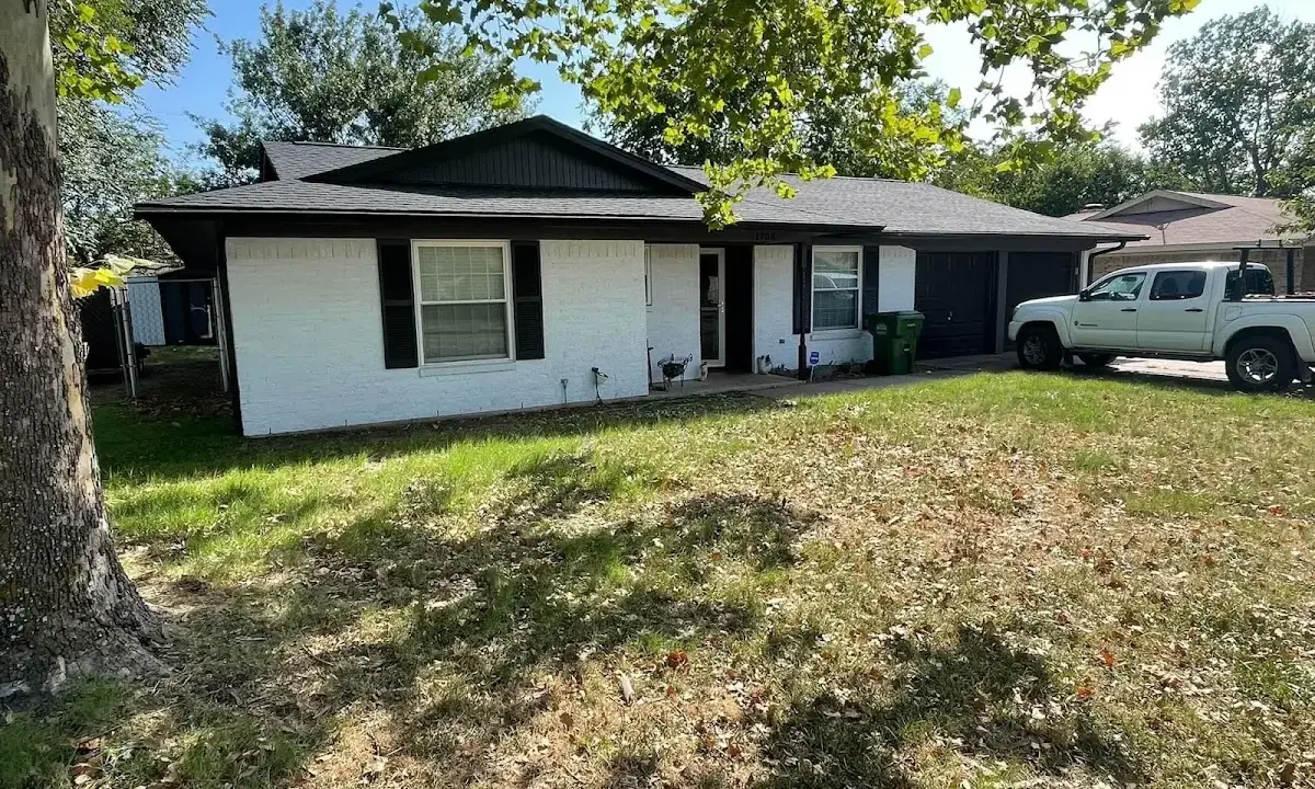 Professional roofing crew working on a residential roof in Winooski